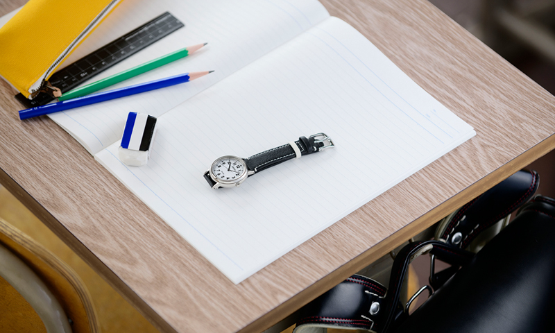 Photo of the Seiko School Time watch (STPX073) on a desk at school