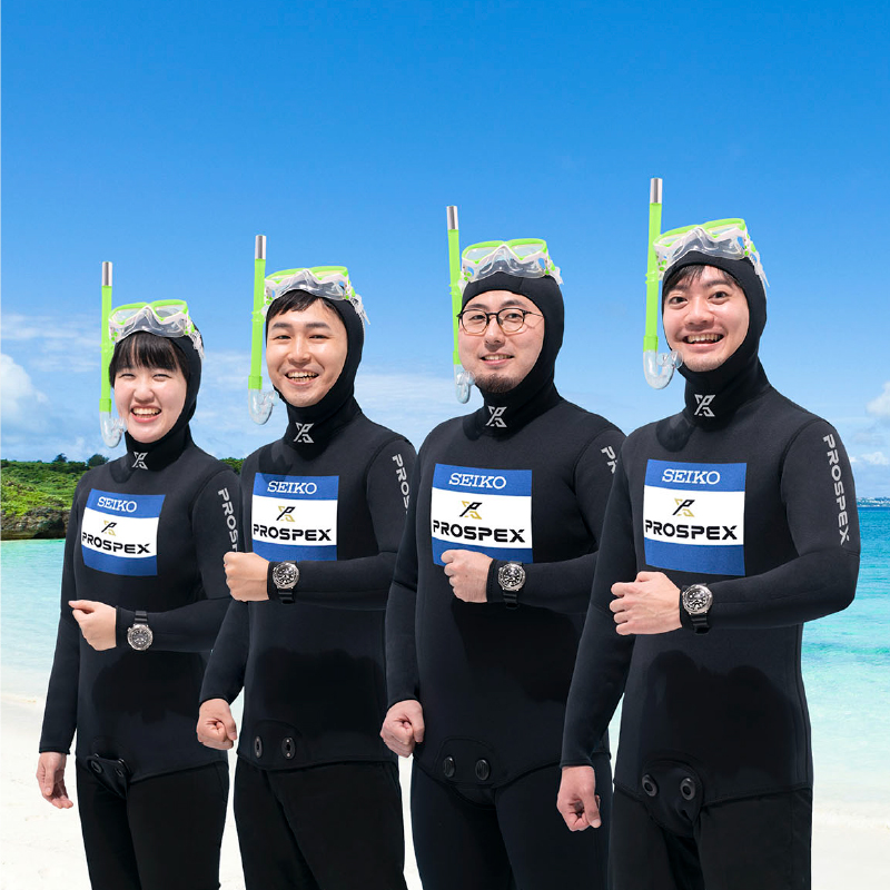 Photo of Koriyama, Sakai, Hibayashi, and Yoshida in wetsuits
