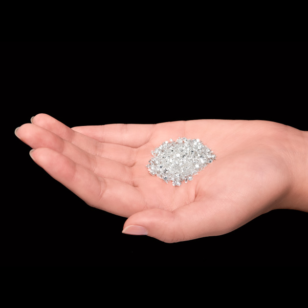 Photo of a bunch of diamonds on a hand