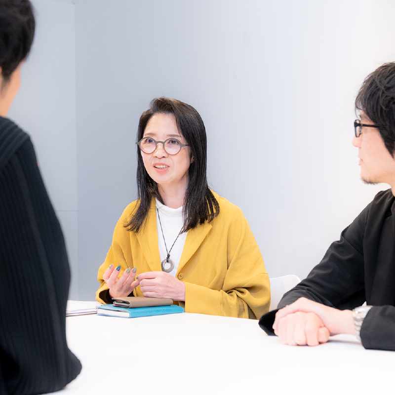 Photo of four people having a conversation