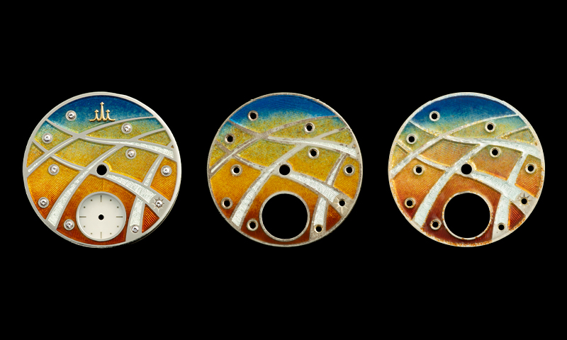 Photo of three enamel dials made as samples