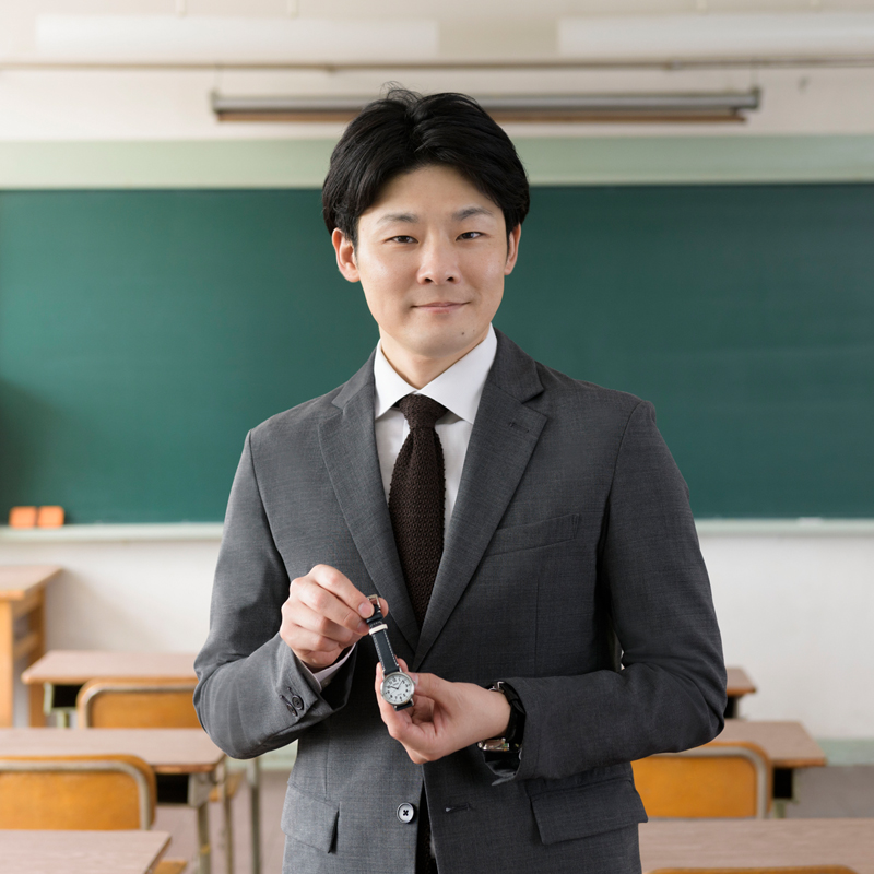Photo of Kento Ito having the Seiko School Time watch. Taken at an elementary school.