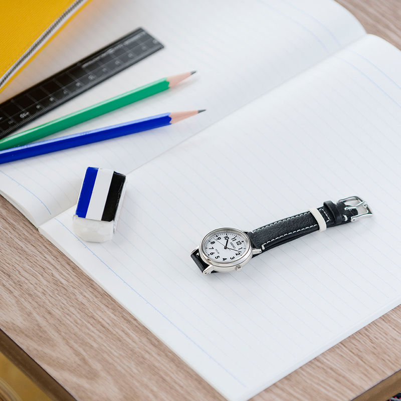 Photo of the Seiko School Time watch (STPX073) on a desk at school
